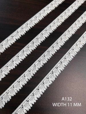 A132 11 MM white knitted fine cotton lace with repeating raised loop motifs