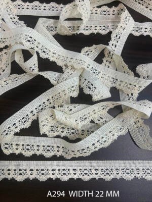 A294 22 MM knitted greige cotton dyeable lace with repeating openwork loop design