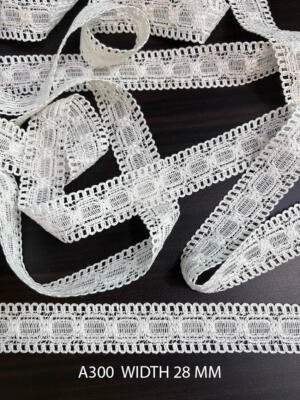 A300 28 MM white knitted lace with repeated rectangular woven motifs and looped edges