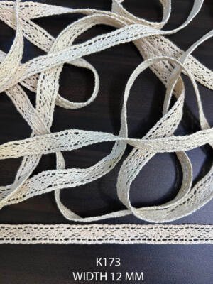 K173 12 mm greige dyeable cotton edging with narrow perforated woven pattern