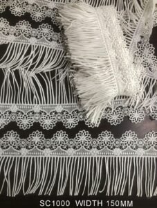 Elegant SC1000 poly white lace with fringe – perfect for couture and bridal accents