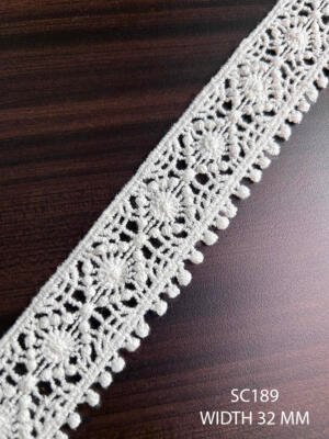 SC189 32 MM white cotton chemical GPO lace with repeating floral design and looped edge