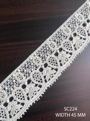 Cotton GPO dyeable lace with repeating paisley floral motifs and openwork detailing