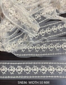 SNE86 – Net Embroidered Laces – COTTON EMBROIDERY ON MESH NET WIDTH 50 MM PRICE PER METER DYEABLE EXPORT QUALITY