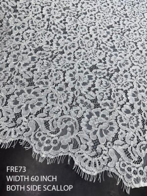 Super fine white Chantilly lace fabric with eyelash finish and dual scalloped edges, 60 inches wide
