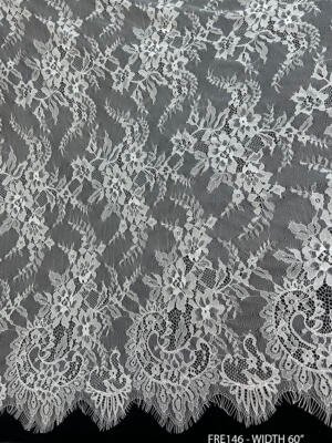 Ultra fine white dyeable Chantilly eyelash lace fabric FRE146 with delicate floral embroidery and scalloped edges on both sides, 60 inches wide.