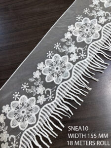 SNEA10 poly organza net lace with GPO fringe – a dramatic blend of texture and elegance for couture garments.