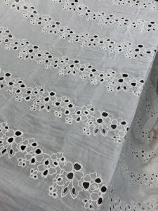 SM595 Schiffli cambric allover embroidery fabric, 50-inch wide, ideal for export-quality garments and boutique creations