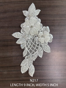 Close-up of N217 floral pearl neck patch showing intricate lacework and pearl embellishments for bridal and festive wear