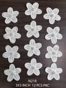 Close-up of N218 neck patch packet showing 12 floral lace appliques for kurtis and designer suits