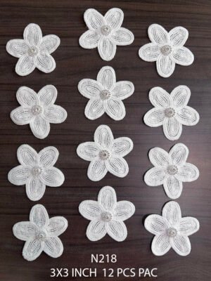 Close-up of N218 neck patch packet showing 12 floral lace appliques for kurtis and designer suits