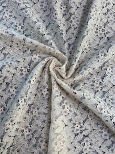 Close-up of RF77 Raschel griege cotton fabric in big width, showing open-knit texture and dyeable finish