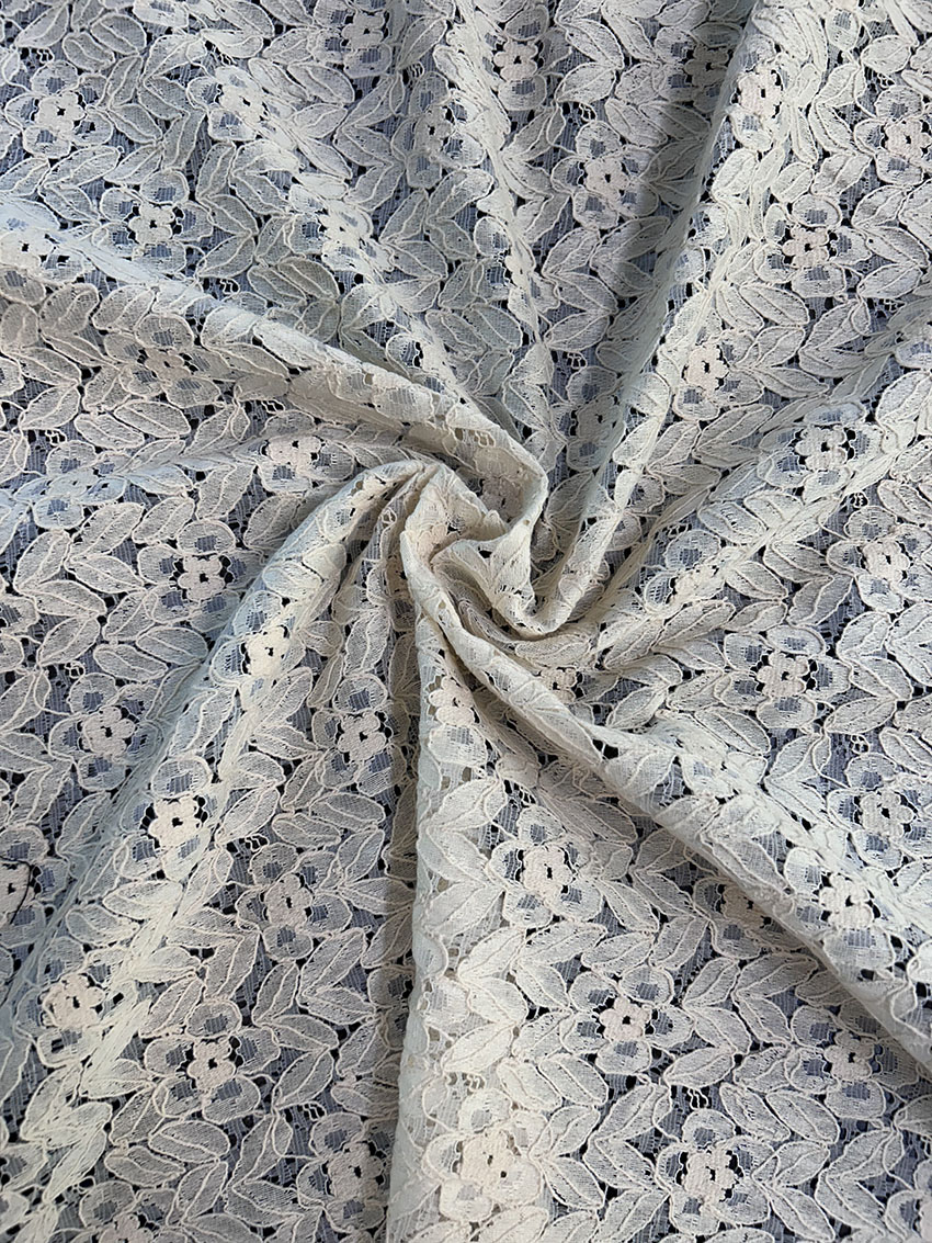 Close-up of RF77 Raschel griege cotton fabric in big width, showing open-knit texture and dyeable finish