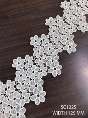 Close-up of SC1225 GPO white lace with floral embroidery