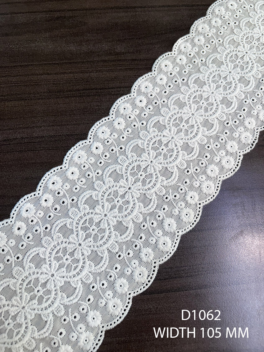White embroidered lace trim with fine detailing and dual scalloped edges, 105 mm width