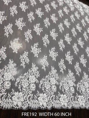 FRE192 Chantilly lace fabric with intricate floral design and eyelash edges, 60-inch wide, ideal for bridal and couture garments