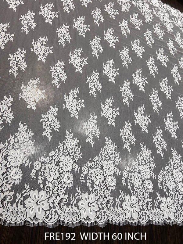 FRE192 Chantilly lace fabric with intricate floral design and eyelash edges, 60-inch wide, ideal for bridal and couture garments