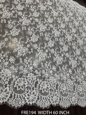 FRE194 Chantilly lace fabric with refined floral motifs and eyelash edges, 60-inch wide, ideal for bridal and couture garments