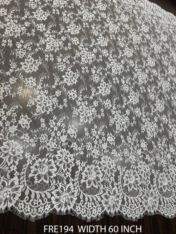 FRE194 Chantilly lace fabric with refined floral motifs and eyelash edges, 60-inch wide, ideal for bridal and couture garments