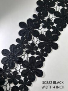 Black GPO floral lace trim SC882, 4 inches wide, featuring bold floral motifs and intricate guipure detailing.