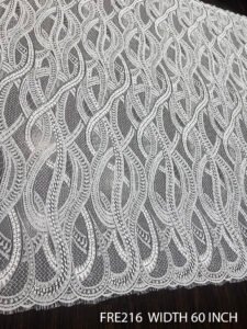 FRE216 white Chantilly lace bridal fabric with 60-inch width, scalloped edges, and dyeable quality