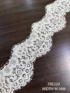 FRE220 dyeable Chantilly lace roll with 90mm width and soft floral detailing