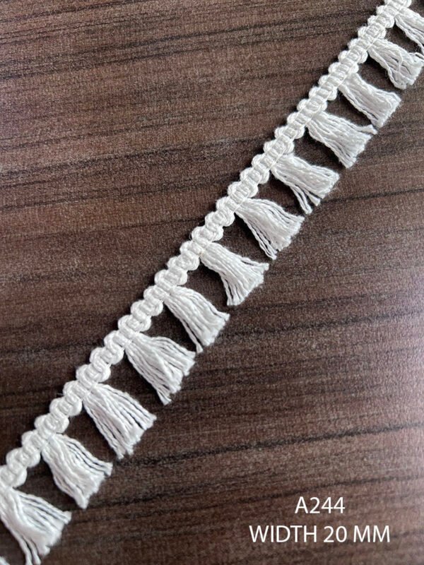 Close-up of A244 cotton white fringe lace, 20mm width, dyeable, sold per meter