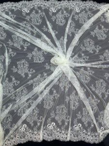 Close-up of FRE233 White Chantilly Eyelash Eyelash Lace Fabric with scallop edges, dyeable, 60 inch width, 3 meter price