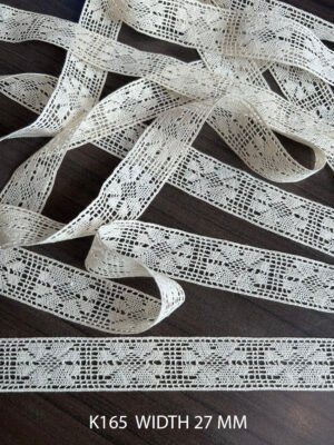 Close-up of fine cotton crochet lace K165, 27mm width, dyeable, sold per meter