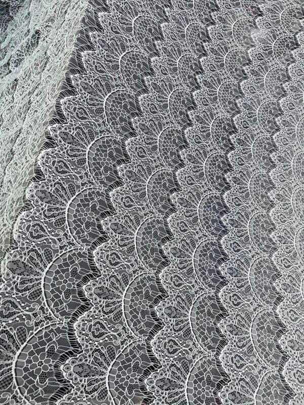 RF139 Raschel Fine Lace Fabric in 60 inch wide nylon, dyeable export quality with single side scalloped edge