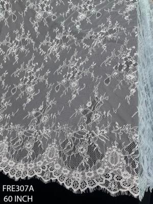 FRE307A white chantilly eyelash lace fabric with floral vine design and scalloped eyelash border width 60 inch for bridal gowns and wedding dresses