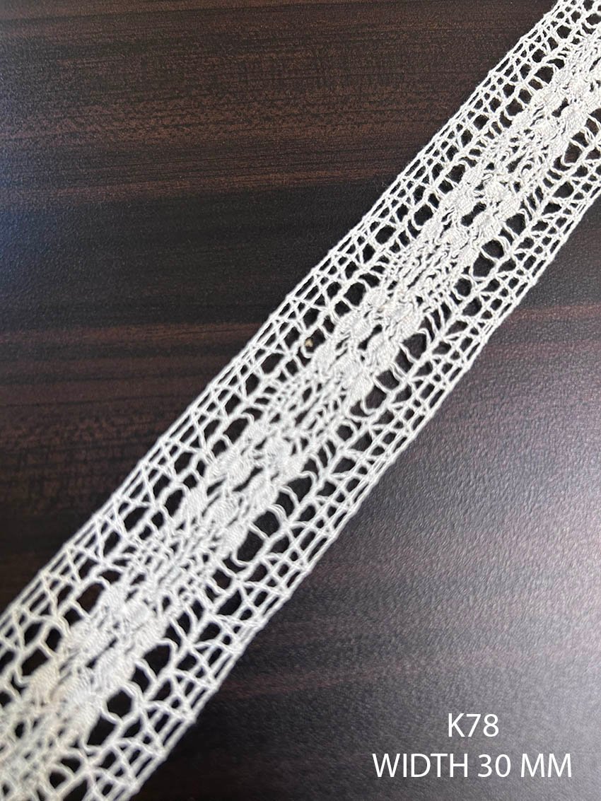K78 white crochet lace 30 mm with central floral vine and geometric open mesh pattern