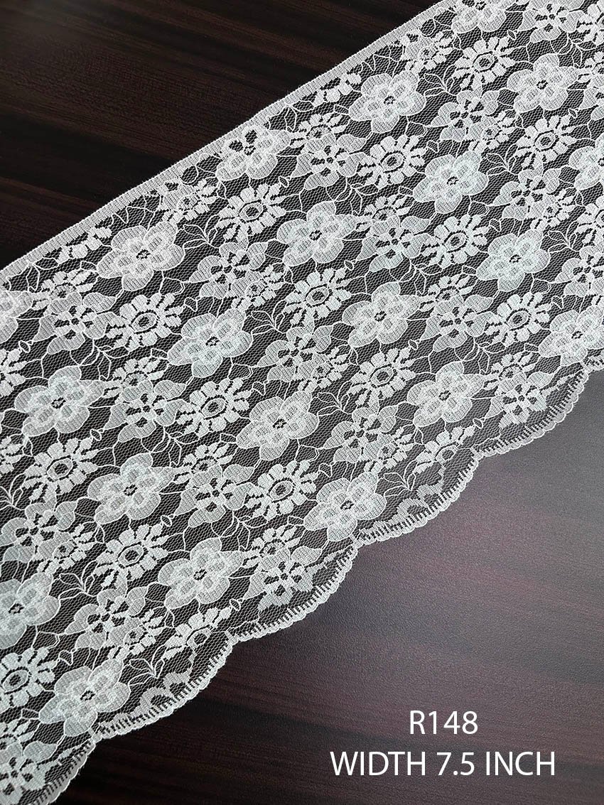 R148 7.5 inch white fine Raschel nylon soft wide lace with floral motifs and scalloped edge