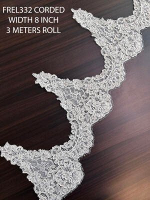 Premium corded Chantilly eyelash lace trim featuring floral motifs, scalloped edging, and fine net background for bridal and couture applications.