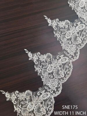 SNE175 pearl white net embroidered corded lace with intricate floral and leaf motifs, 11 inch width